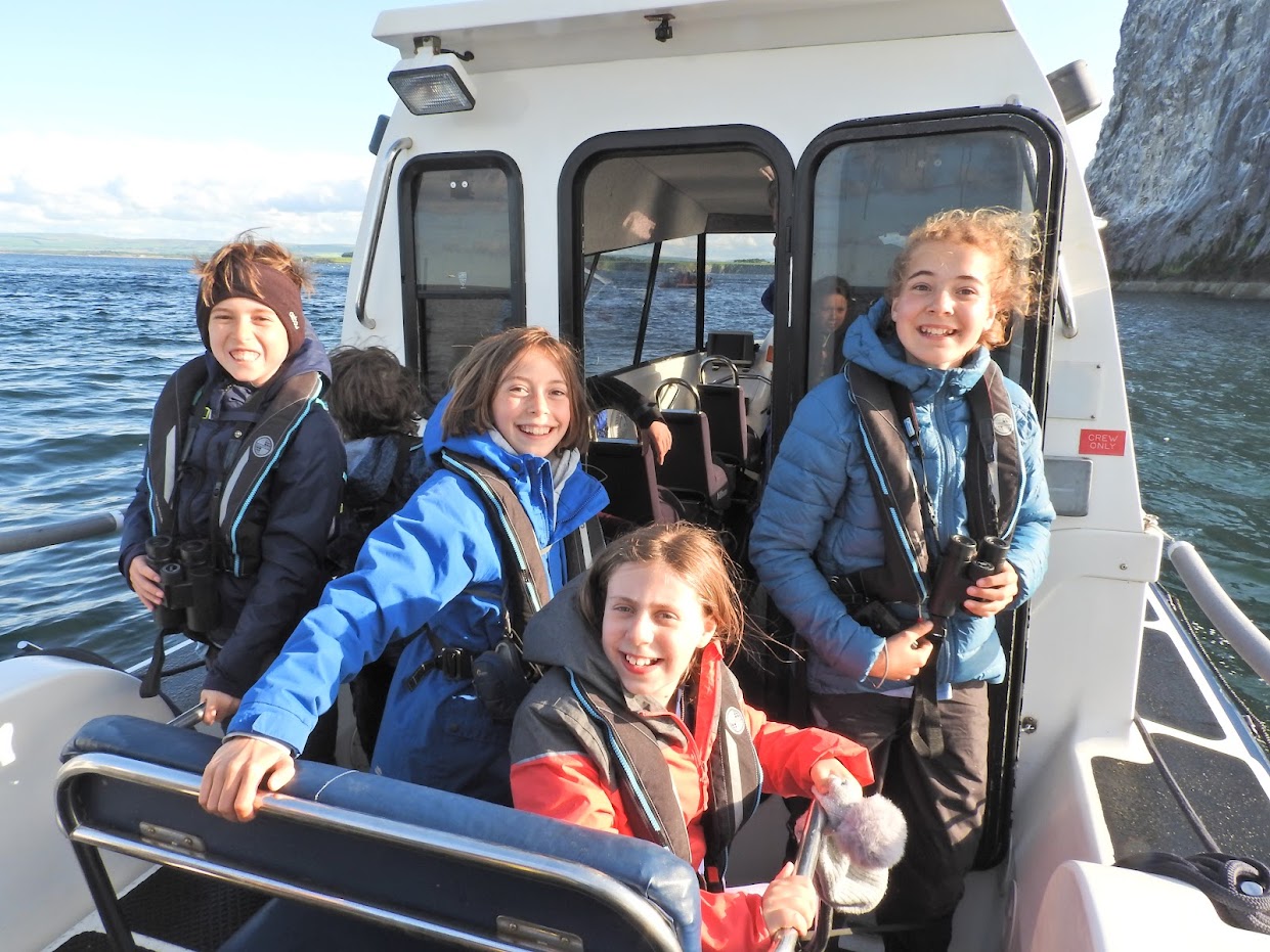 Participants of the SOC/BTO Scottish Bird Camp 2023 on a boat trip to Bass Rock. 