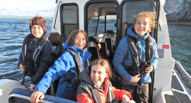Participants of the SOC/BTO Scottish Bird Camp 2023 on a boat trip to Bass Rock. 