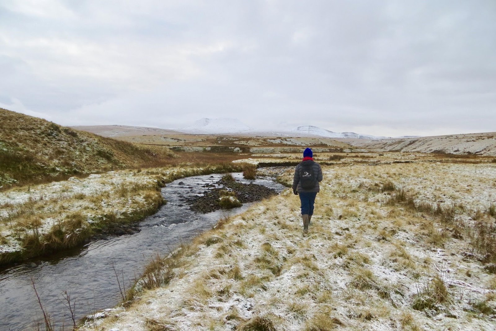 Gethin walking along a snowy riverbank