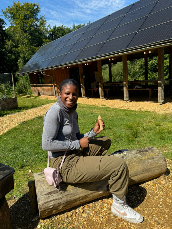 Young Leaders Course participant Queen during a whittling class, led by fellow participant Joe.